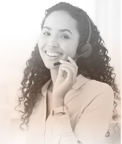 curly haired female with brown skin talking on a headset smiling